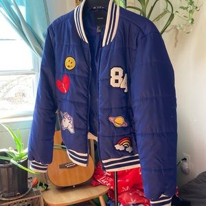 Blue L puffy varsity style jacket with front patches